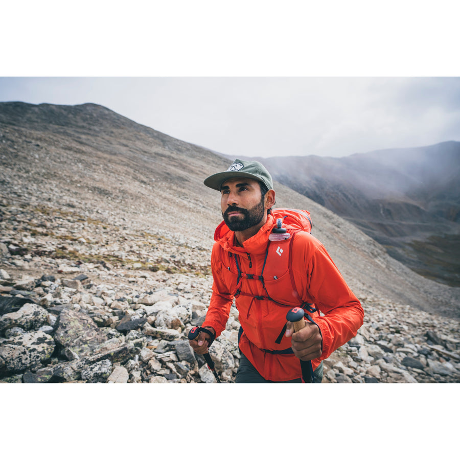 A hiker wearing the Alpine Start Hoody. 