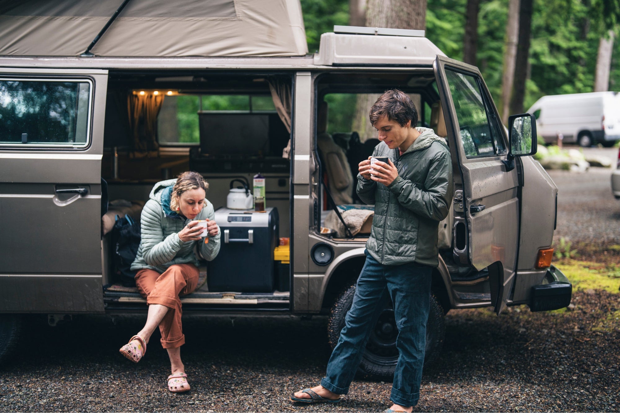Two climbers caffinate at the van before a day of sending. 